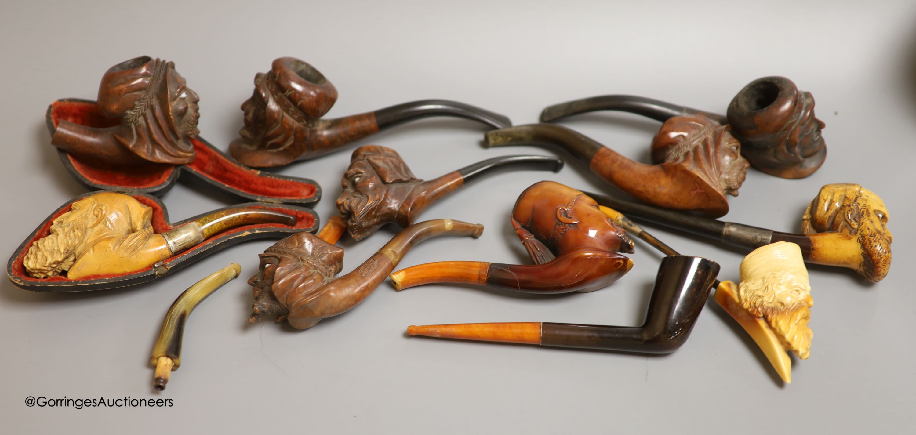 An Inuit stone bear and a collection of Meerschaum pipes
